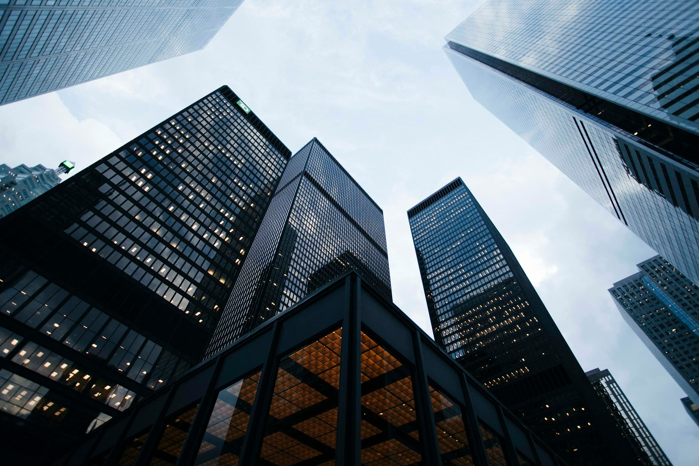 Looking up at commercial office towers — the kind of income-producing real estate Capital Market Funds finances